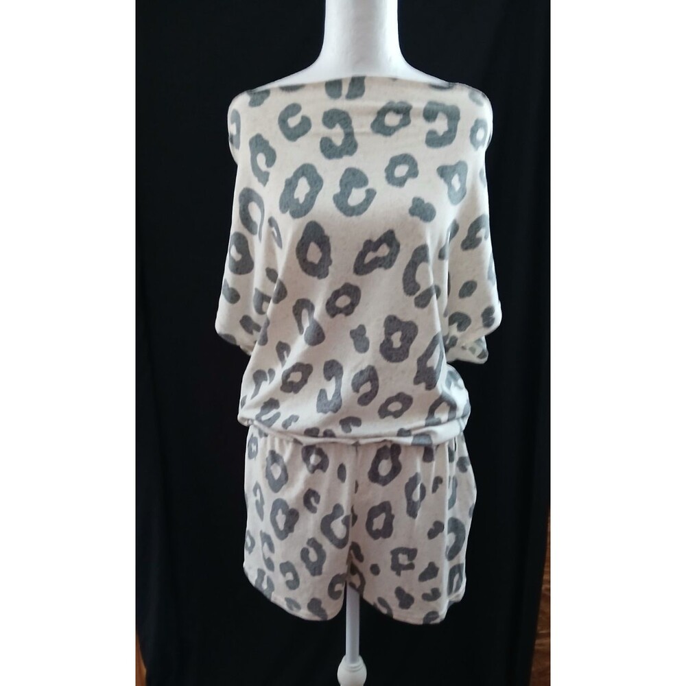 REB. in J. 220 Off White Romper with black  giraffe prints elastic waistband S